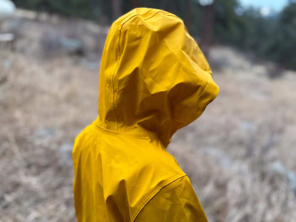 kid in a yellow rain jacket