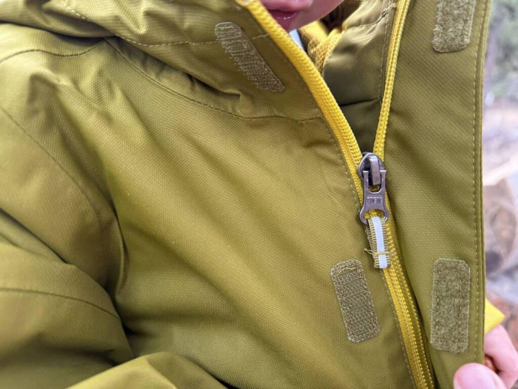 Close-up detail of Columbia Hikebound II Rain Jacket zipper pull on a toddler