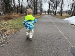 Full-length back view of the Eddie Bauer Toddler Rain Jacket in size 2T on a 2-year-old