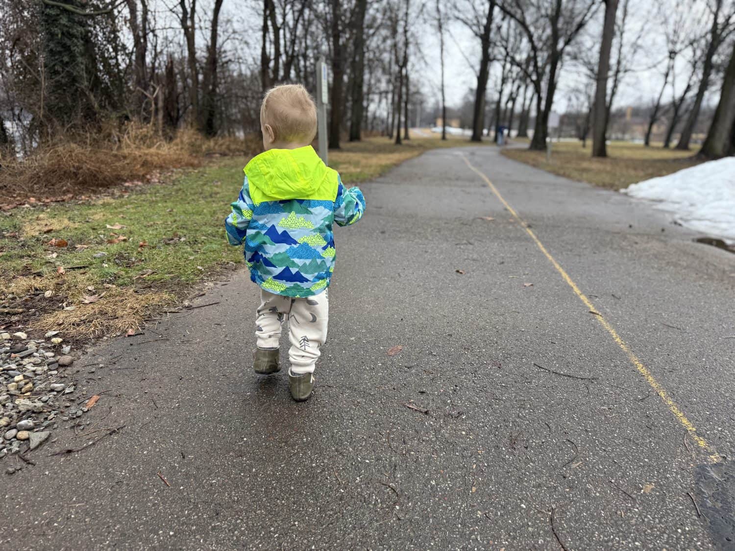 Full-length back view of the Eddie Bauer Toddler Rain Jacket in size 2T on a 2-year-old