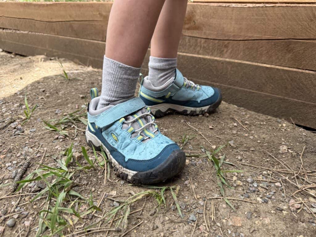 Close view of the rubber toe cap and hook-and-loop strap on KEEN Targhee IV Low Waterproof kids shoes