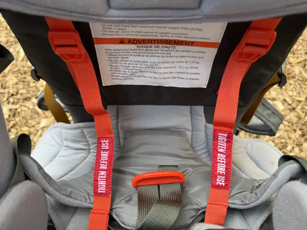 Five-point child harness inside the cockpit of the Kelty Journey PerfectFIT Elite child carrier