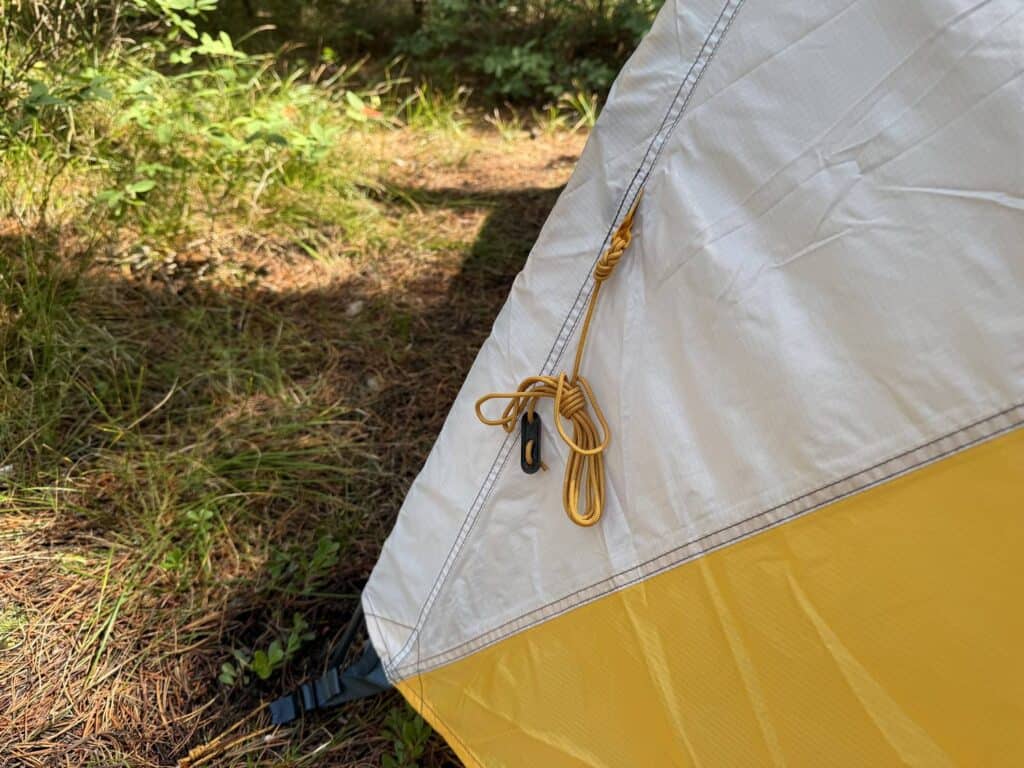 Coiled yellow guyline on the rainfly of the Mountain Hardwear Mineral King 3