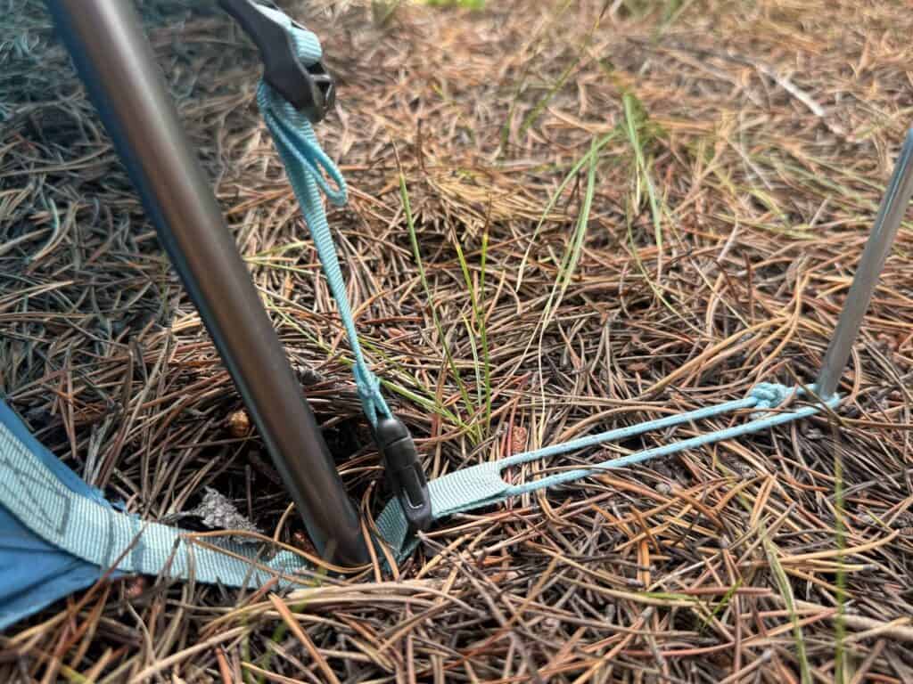 Tent stake through a corner webbing loop on the NEMO Aurora Highrise 6