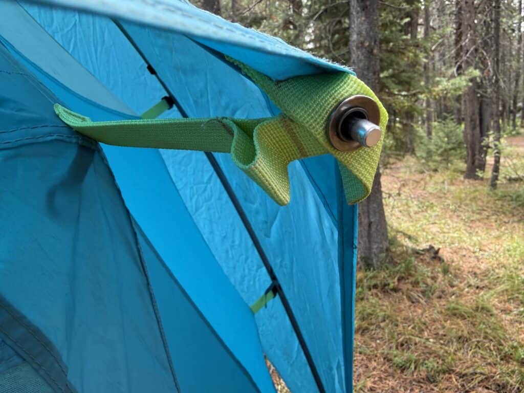 Rainfly attachment clipped to a pole end on the NEMO Aurora Highrise 6