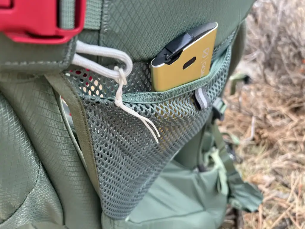 Side mesh pocket on the Osprey Poco Premium child carrier holding a snack
