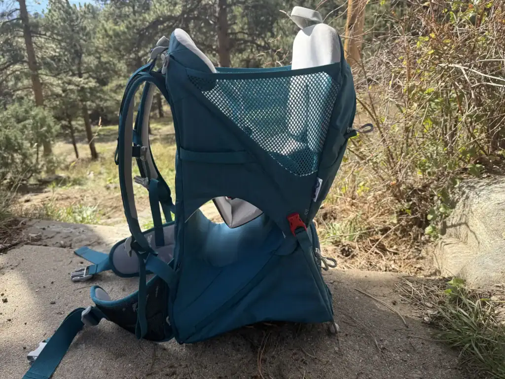 Osprey Poco SLT child carrier standing on its folding frame outdoors