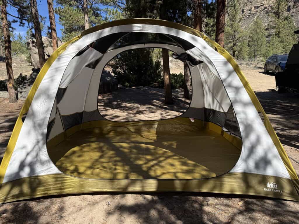 REI Co-op Base Camp 6 tent body with both doors open, looking through to the campsite