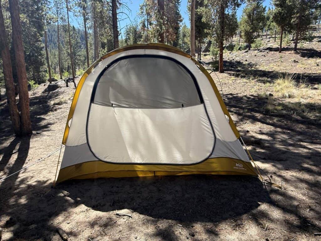 REI Co-op Base Camp 6 tent body with the front door zipped closed