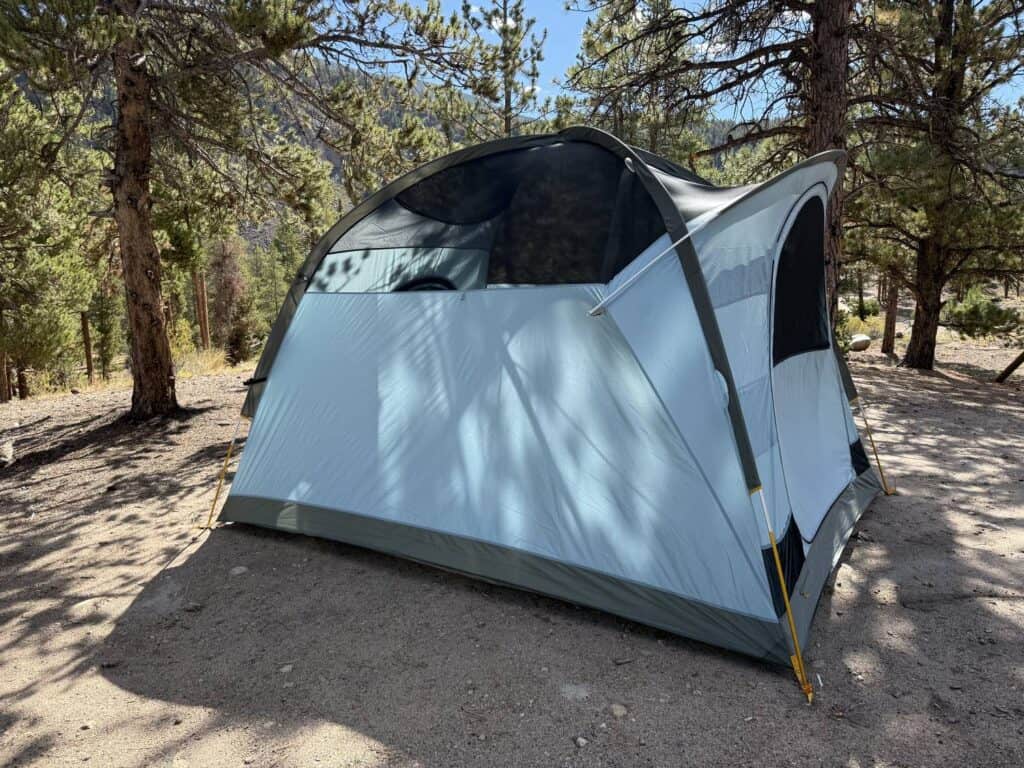 REI Co-op Westward 6 tent body with a mesh roof and windows at a pine campsite