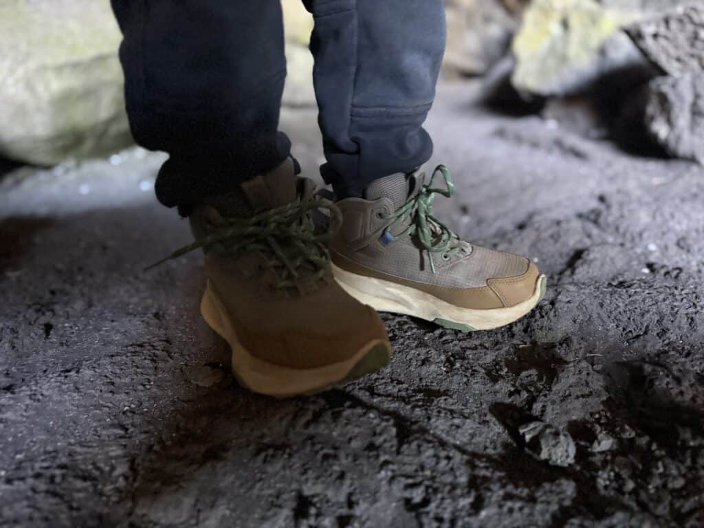 Close view of The North Face Fastpack II Mid Waterproof kids boots on the floor of a lava tube at Craters of the Moon